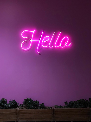 A neon sign that says hello